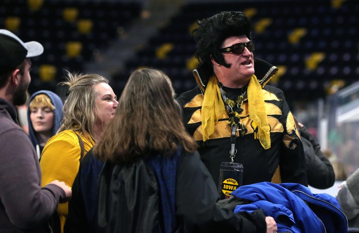 Gregory Suckow, better known as Hawkeye Elvis, right, chats during the Special Olympics Iowa Spring Classic opening ceremony Friday, March 8, 2024 at Xtream Arena in Coralville, Iowa.