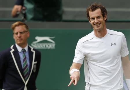 Andy Murray of Britain smiles during his match against Vasek Pospisil of Canada at the Wimbledon Tennis Championships in London, July 8, 2015. REUTERS/Suzanne Plunkett