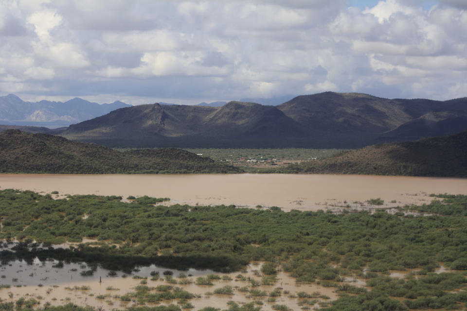 This Oct. 3, 2018 photo shows the lake at Menagers Dam southwest of Sells, Ariz. Flooding remains a concern for the community in a remote area of the southern Arizona desert where authorities say the dam still has the potential to fail with more rain forecast for later this week. (Richard Saunders/Tohono O'odham Nation Department of Public Safety via AP)