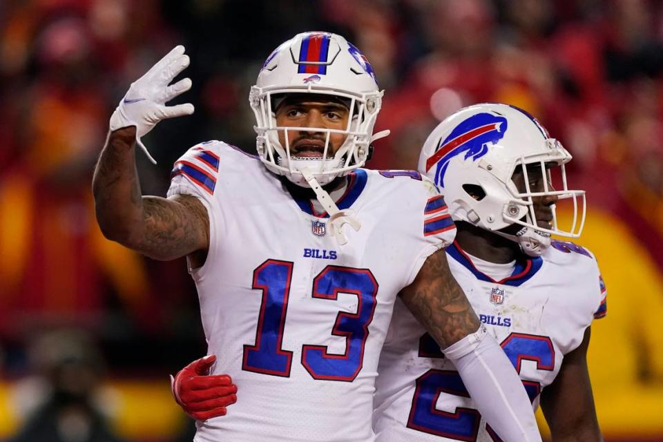 Buffalo Bills wide receiver Gabriel Davis (13) celebrates with teammate Devin Singletary (26) after catching a 19-yard touchdown pass during the second half of an NFL divisional round playoff football game against the Kansas City Chiefs, Sunday, Jan. 23, 2022, in Kansas City, Mo.
