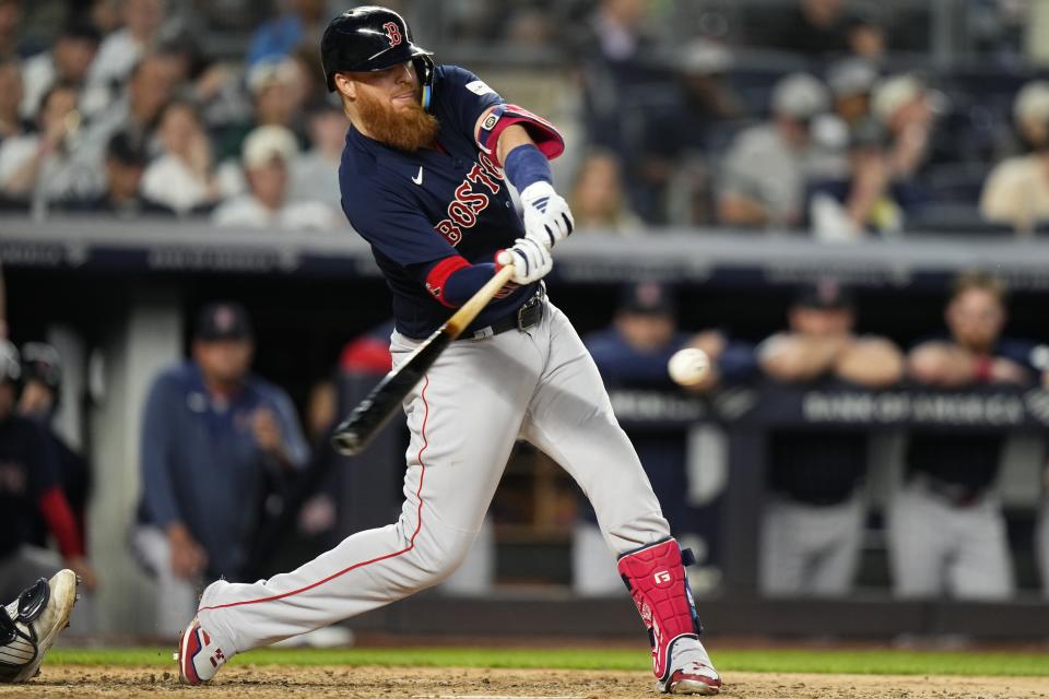 Boston Red Sox's Justin Turner hits a single against the New York Yankees during the seventh inning of a baseball game Friday, June 9, 2023, in New York. (AP Photo/Frank Franklin II)