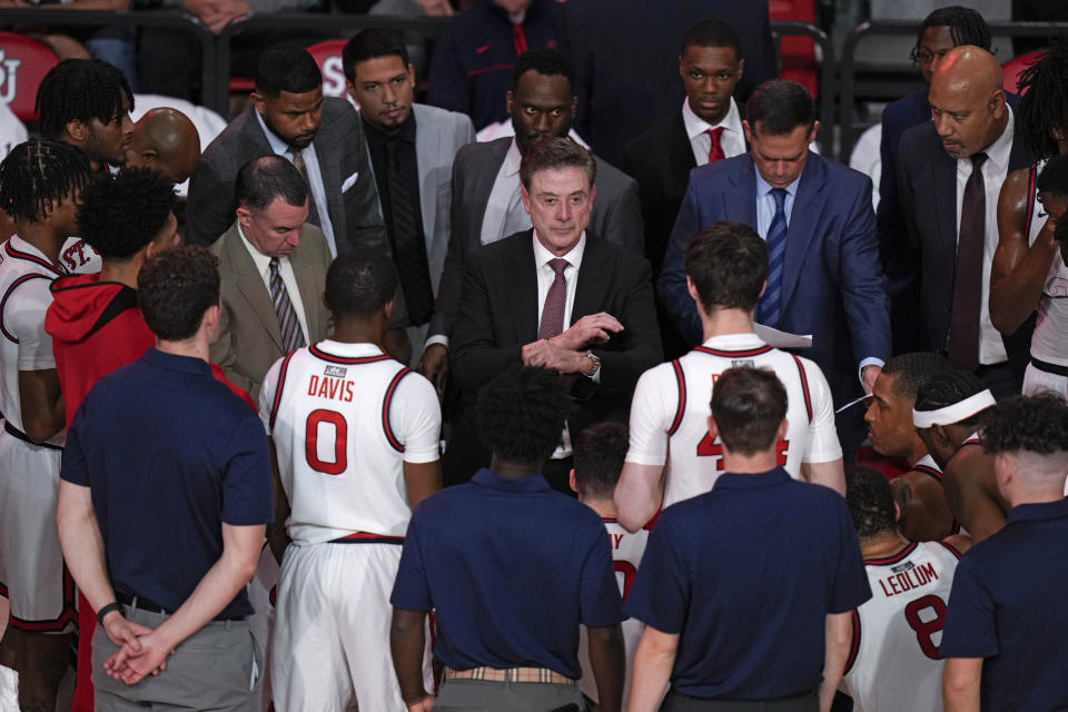 St. John's head coach Rick Pitino, center, talks to his team during a time during the second half of an NCAA college basketball game against Stony Brook, Tuesday, Nov. 7, 2023, in New York. St. John's defeated Stony Brook 90-74. (AP Photo/Seth Wenig)