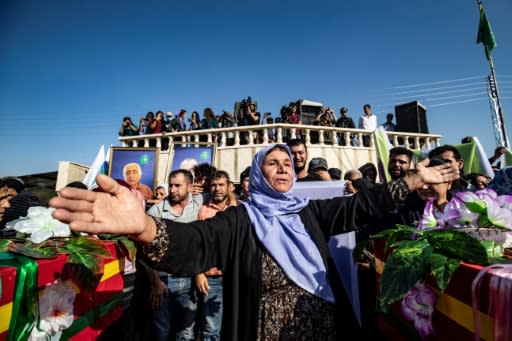 Mourners attend a funeral for Kurdish casualties
