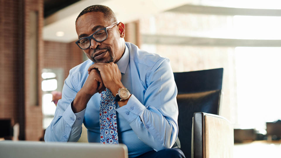 Shot of a corporate businessman working in an office.