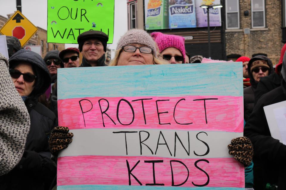 Stephanie Kalka, 54, holds a sign supporting transgender students during a rally Feb. 25, 2017, in Chicago against the Trump administration's reversal of federal protections of bathroom rights, warning it risked exposing young people to hate-fueled violence.