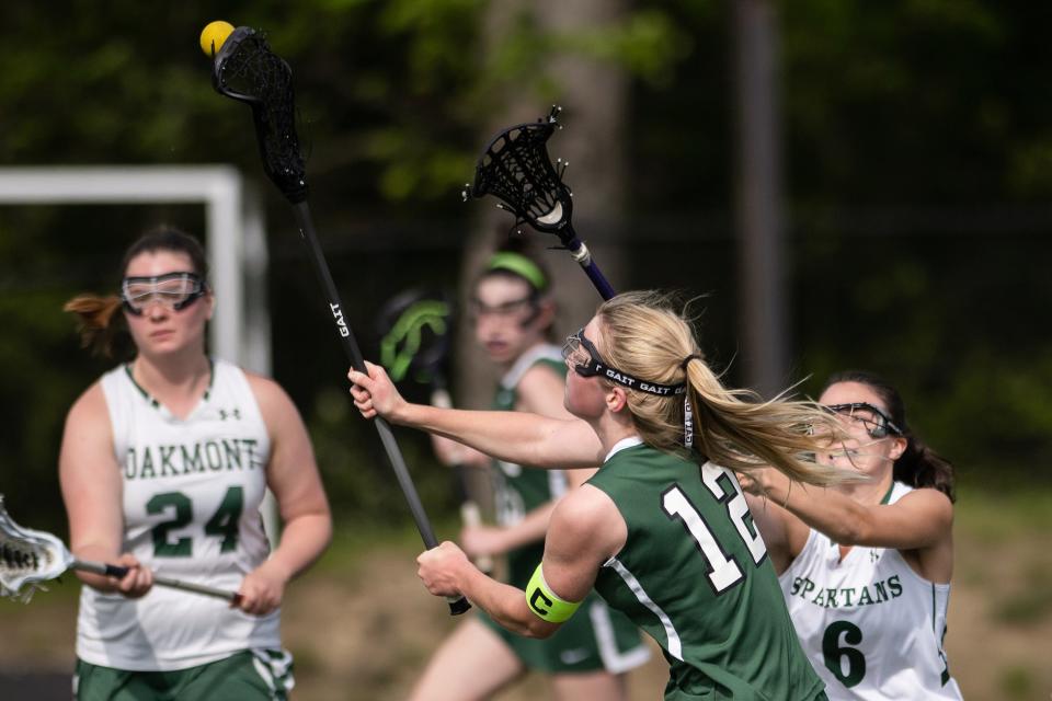 Tahanto's Alison Stevens fires a shot over Oakmont's Addison Collette to tie the game, 6-6, with 5:44 left in the first half on Tuesday May 16, 2023 in Ashburnham.