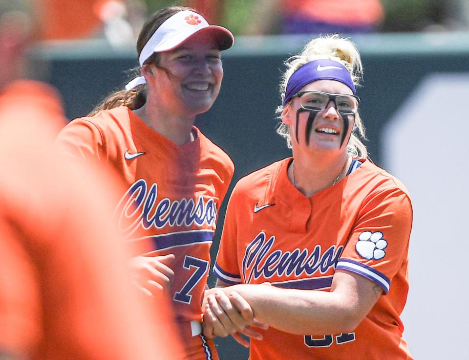 Clemson sophomore Valerie Cagle (72) and Clemson freshman Millie Thompson (87) smile after the game with UNC Wilmington during the NCAA Clemson Softball Regional at McWhorter Stadium in Clemson Friday, May 20, 2022. Thompson pitched a complete game winning 9-0 in six innings.