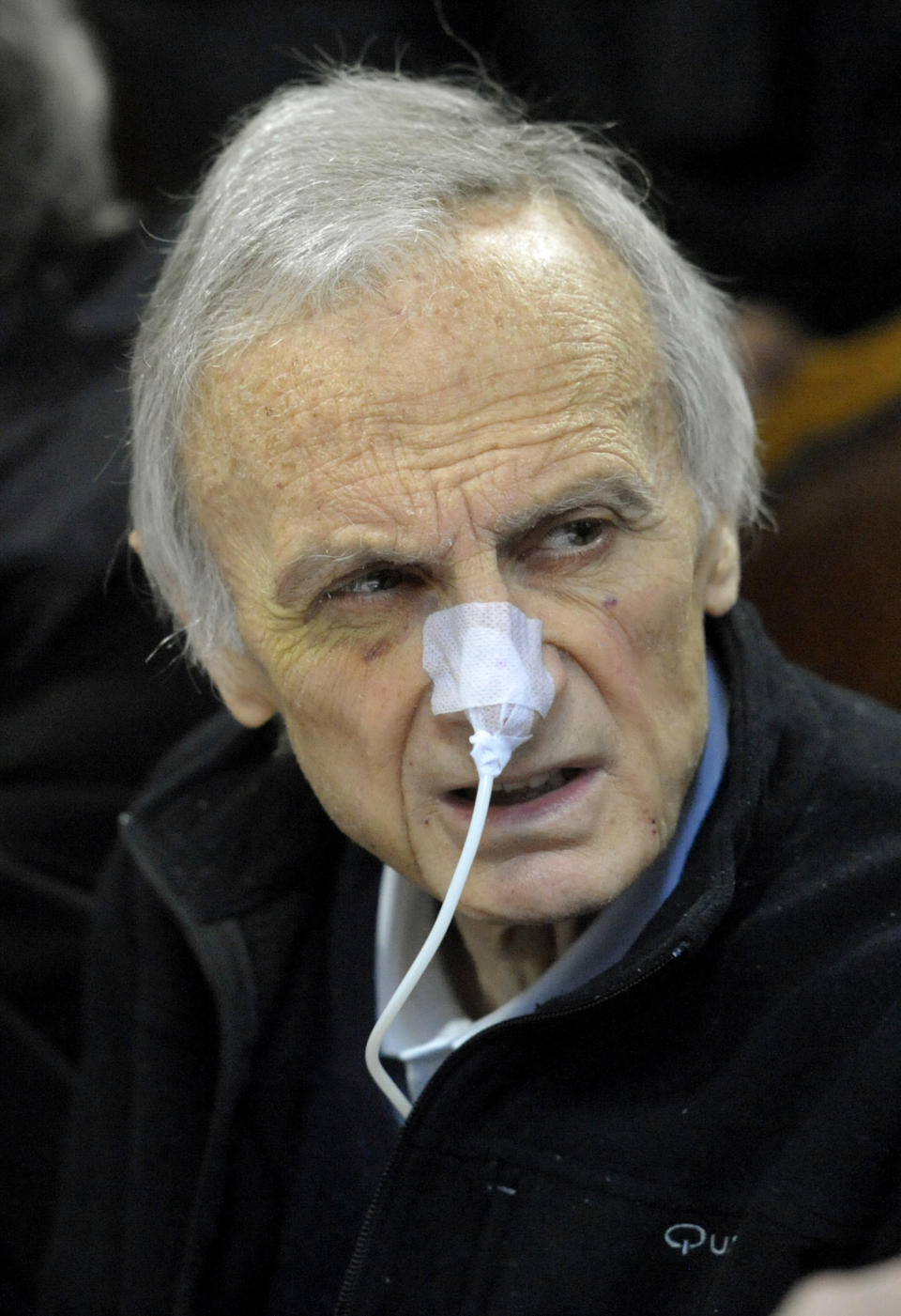 Italian dairy giant Parmalat founder Calisto Tanzi, with a medical tube attached to his nose, attends an appeal trial hearing, in Bologna, Italy, Monday, March 26, 2012. Tanzi in 2010 was convicted of fraudulent bankruptcy and criminal association in Europe's largest corporate failure, the euro14 billion failure (US$18 billion) of his dairy empire in 2003. He was sentenced to 8 years and one month in prison. Tanzi has been in ill health for months. (AP Photo/Marco Vasini)