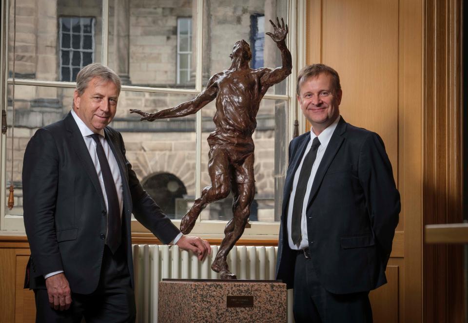 John MacMillan, right, from The Eric Liddell Community, with Edinburgh University’s Professor Peter Mathieson at the statue of Liddell in the university (The Eric Liddell 100/PA)