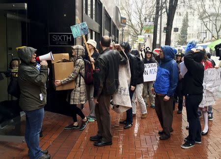 Residents and clean air activists protest in front of the state's Department of Environmental Quality office in Portland, Oregon March 4, 2016. REUTERS/Shelby Sebens