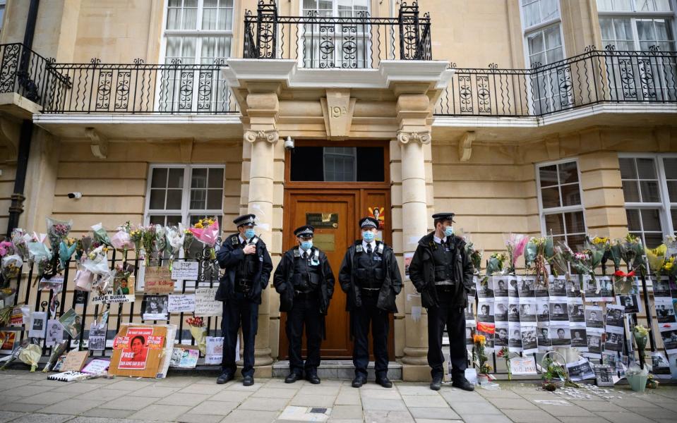 Police officers stand guard after former Myanmar Ambassador to the UK Kyaw Zwar Minn was locked out  - Leon Neal /Getty Images Europe 