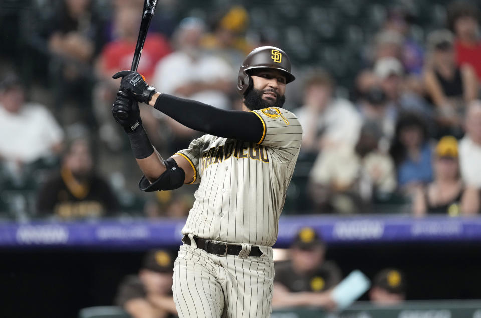 San Diego Padres pinch hitter Nomar Mazara strikes out against Colorado Rockies relief pitcher Jake Bird to end the ninth inning of a baseball game Friday, June 17, 2022, in Denver. (AP Photo/David Zalubowski)