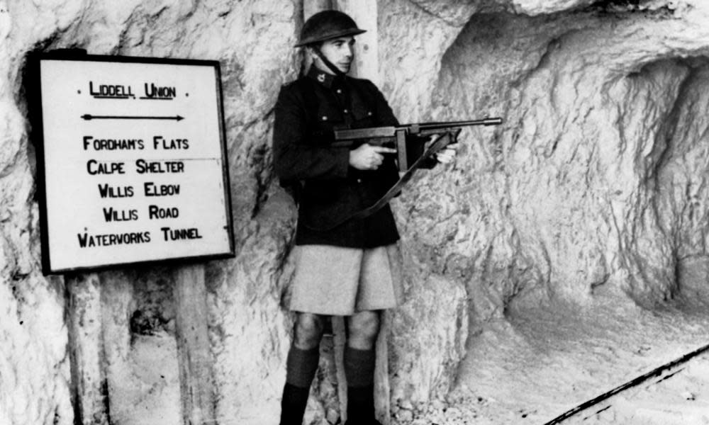 A British soldier guards a tunnel complex in Gibraltar, circa 1940.