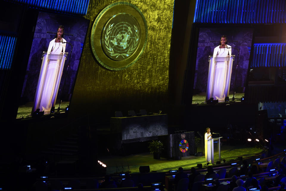 Amanda Gorman recites a poem during an event called "SDG Moment" at United Nations headquarters, Monday, Sept. 19, 2022. The event is meant to highlight the urgency and importance of the United Nations' sustainable development goals. (AP Photo/Seth Wenig)