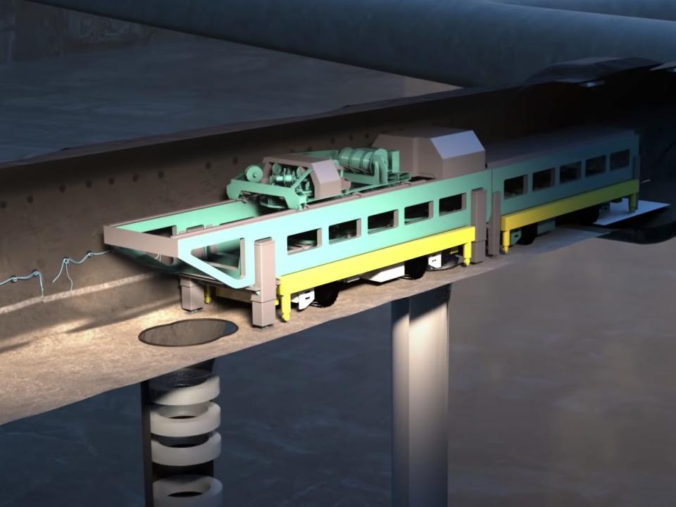 A still from an animation shows a machine backfilling the canister holes with bentonite in Onkalo.