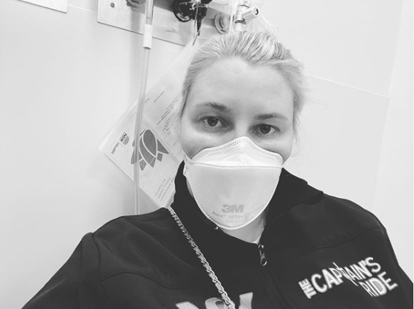 Sally Hawach in hospital with a mask on her face