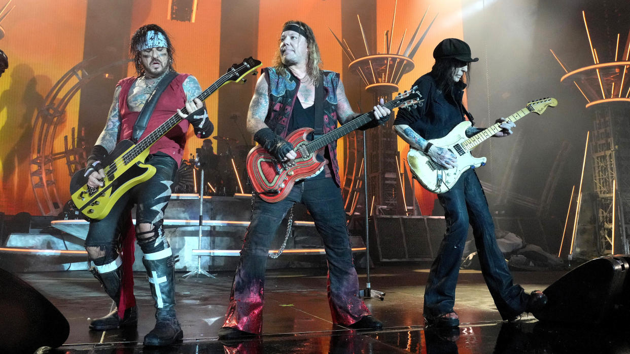  Nikki Sixx, Vince Neil and Mick Mars of Mötley Crüe perform onstage during The Stadium Tour at Nationals Park on June 22, 2022 in Washington, DC 