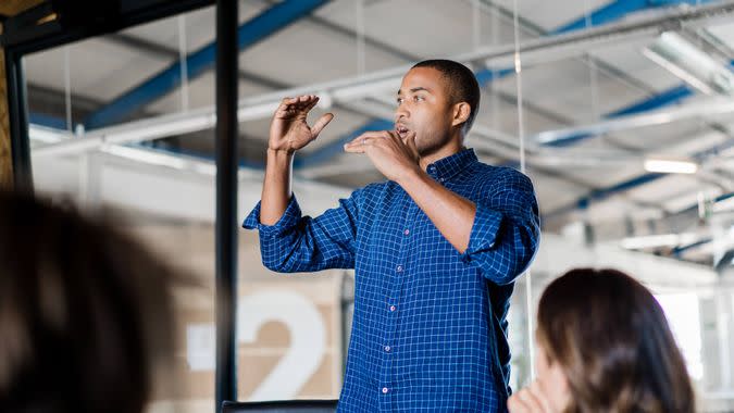 A photo of young businessman giving presentation.