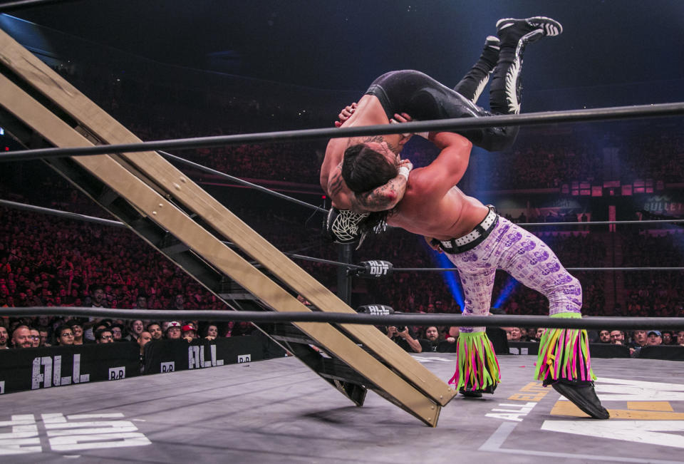 The Young Bucks are seen during their match against the Lucha Bros. at All Elite Wrestling's "All Out" event in August. (Photo by James Musselwhite/Courtesy of AEW)