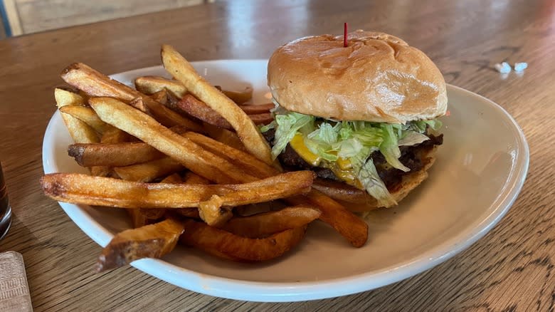 Cheeseburger and french fries on plate