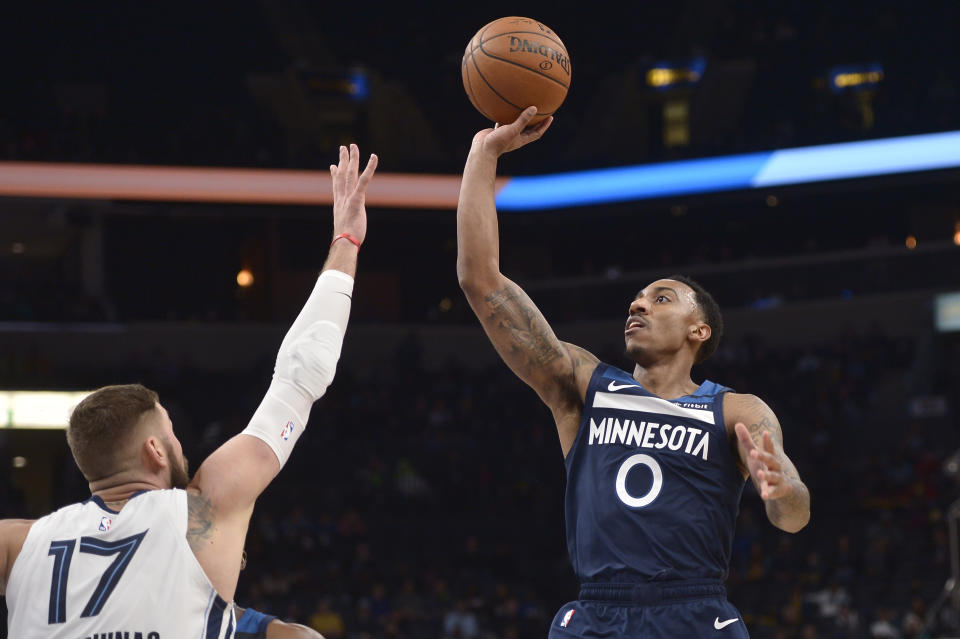 Minnesota Timberwolves guard Jeff Teague (0) shoots against Memphis Grizzlies center Jonas Valanciunas (17) during the first half of an NBA basketball game Tuesday, Jan. 7, 2020, in Memphis, Tenn. (AP Photo/Brandon Dill)