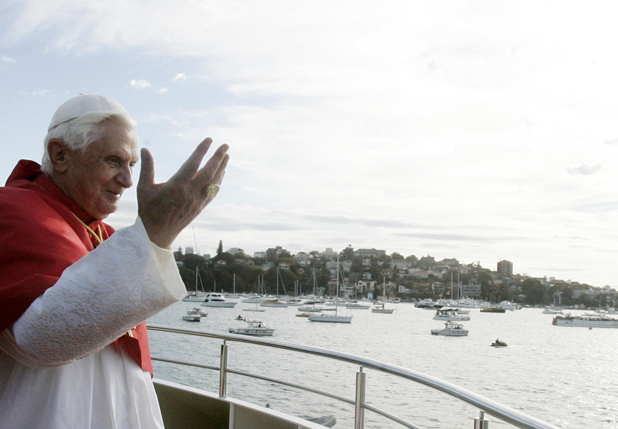 FILE - Pope Benedict XVI greets pilgrims aboard of the Sydney 2000 vessel in Sydney, Australia, on July 17, 2008. Pope Emeritus Benedict XVI, the German theologian who will be remembered as the first pope in 600 years to resign, has died, the Vatican announced Saturday. He was 95. (AP Photo/Gregorio Borgia, File)