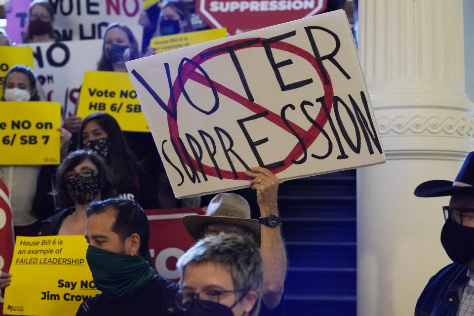 FILE - In this May 6, 2021 file photo, a group opposing new voter legislation gather outside the House Chamber at the Texas Capitol in Austin, Texas. Texas Republicans dug in Saturday, May 29 for a final weekend vote on some of the most restrictive new voting laws in the U.S., finalizing a sweeping bill that would eliminate drive-thru voting, reduce polling hours and scale back Sunday voting, when many Black churchgoers head to the polls. (AP Photo/Eric Gay, File)