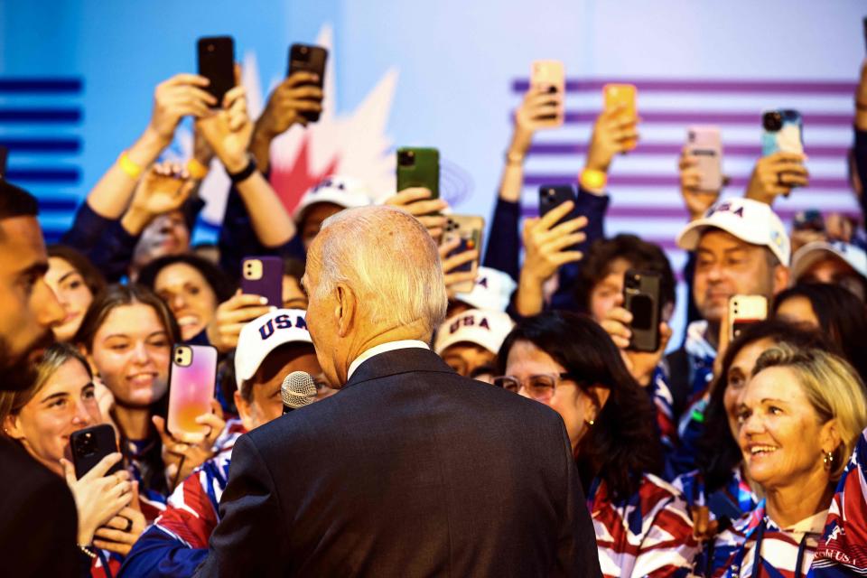 Joe Biden speaks with US athletes at the Teddy Stadium in Jerusalem (POOL/AFP via Getty Images)