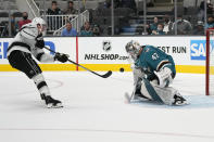 San Jose Sharks goaltender James Reimer (47) blocks a shot on goal by Los Angeles Kings left wing Austin Wagner (27) during the second period of an NHL hockey preseason game Tuesday, Sept. 28, 2021, in San Jose, Calif. (AP Photo/Tony Avelar)