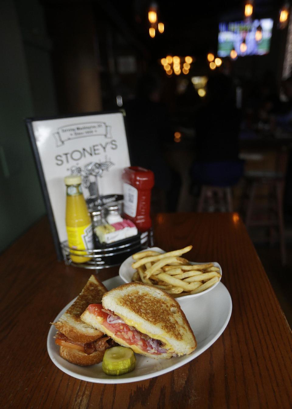 This July 30, 2013 photo shows a grilled cheese sandwich at Stoney's Lounge in Washington. Stoney's is located in the Logan Circle neighborhood of Washington. (AP Photo/Pablo Martinez Monsivais)