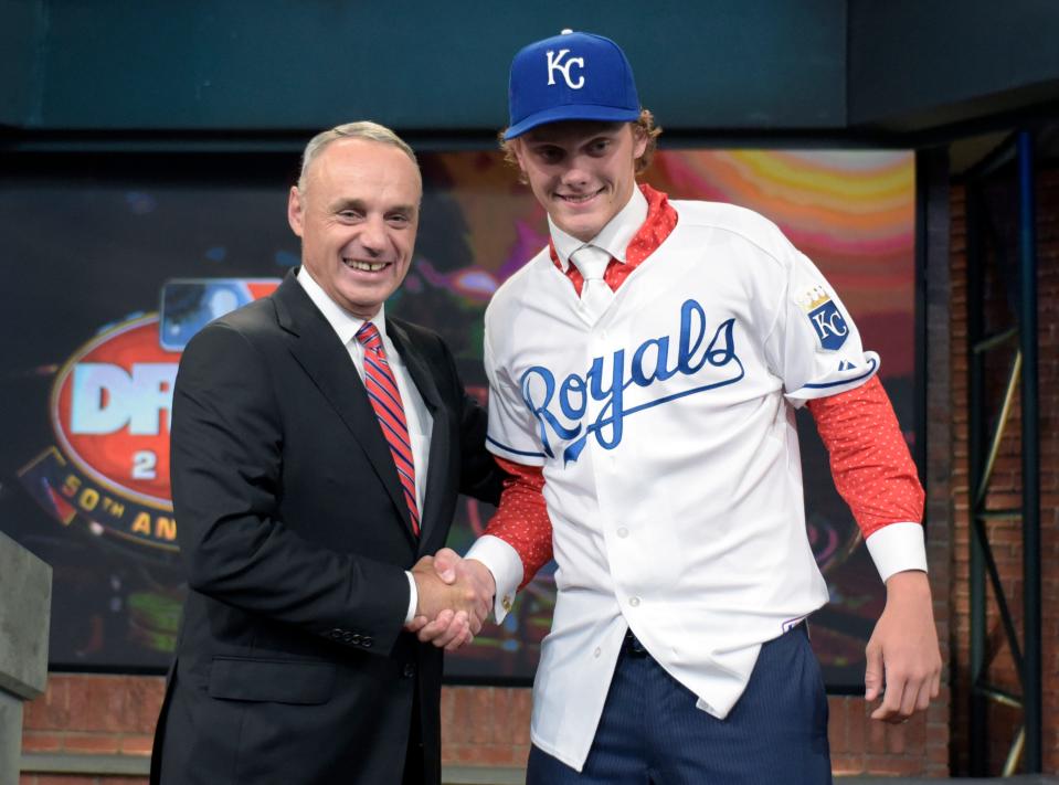 Commissioner of Major League Baseball Rob Manfred, left, poses with pitcher Ashe Russell from Cathedral High School in Indianapolis, Ind., at the 2015 MLB baseball draft Monday, June 8, 2015, in Secaucus, N.J. Whitley was chosen by the Kansas City Royals with the 21st selection.