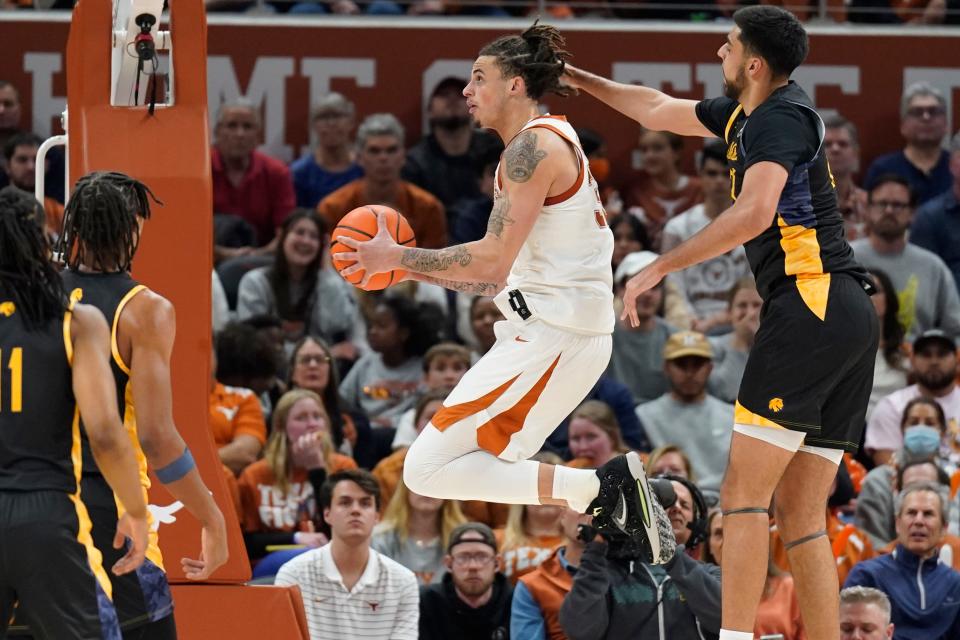 Texas forward Christian Bishop drives to the basket in the Longhorns' win over Texas A&M-Commerce on Tuesday. The No. 6 Longhorns open Big 12 play on Saturday at Oklahoma.