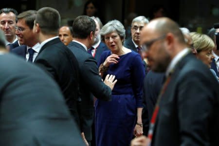 Britain's Prime Minister Theresa May (C) attends the EU summit in Brussels, Belgium October 19, 2017. REUTERS/Yves Herman