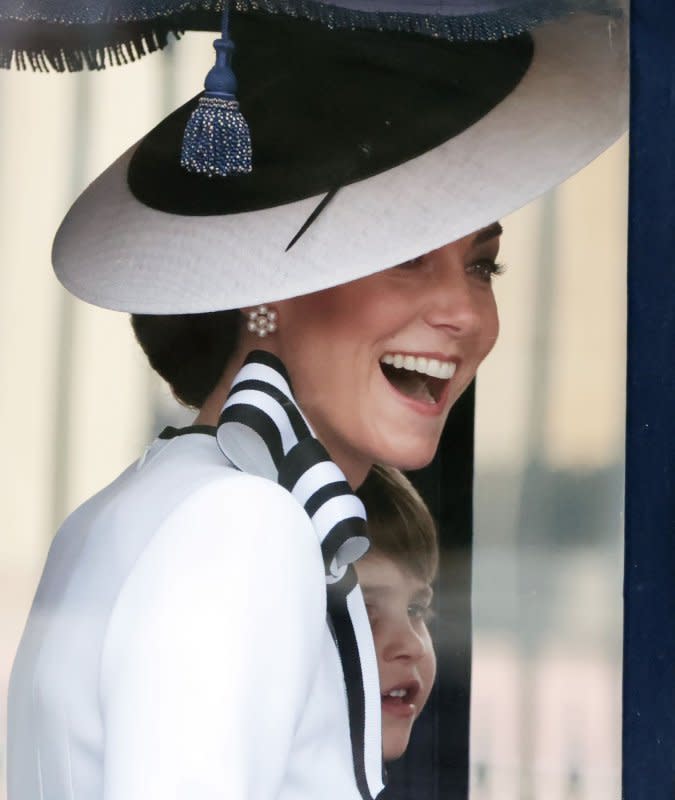 Princess Catherine and her daughter Princess Charlotte travel in a Royal carriage at the annual Trooping the Colour on The Mall in London on Saturday. Photo by Hugo Philpott/UPI