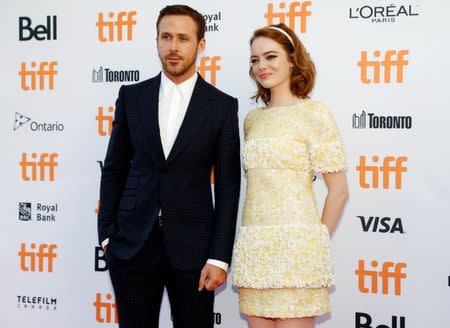 Actor Ryan Gosling arrives with Emma Stone on the red carpet for the film "La La Land" during the 41st Toronto International Film Festival (TIFF), in Toronto, Canada, September 12, 2016. REUTERS/Mark Blinch