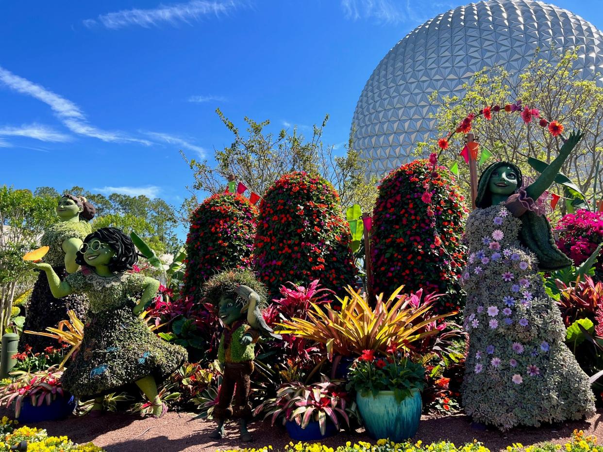 EPCOT International Flower & Garden Festival's colorful "Encanto" display greets park guests.