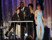 Idiris Elba accepts the award for Outstanding Performance by a Male Actor in a Television Movie or Miniseries for his role in "Luther" from presenters Jacob Tremblay (L) and Brie Larson (R) at the 22nd Screen Actors Guild Awards in Los Angeles, California January 30, 2016. REUTERS/Lucy Nicholson