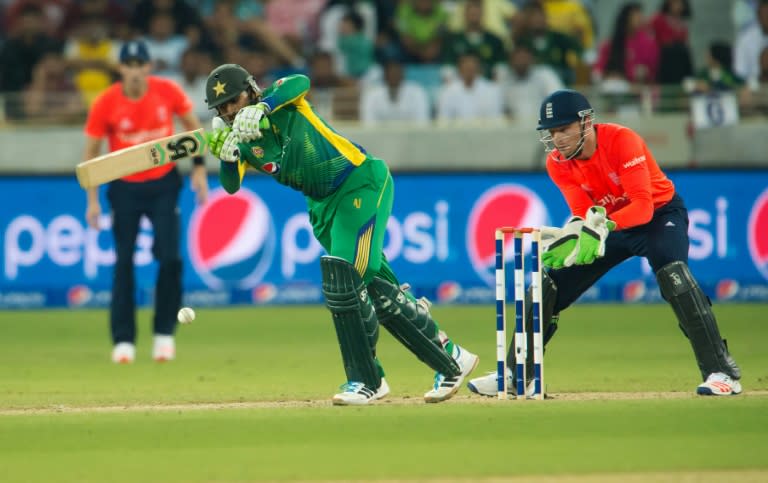 Pakistan's Shoaib Malik (C) bats during the second T20 cricket match between Pakistan and England at the Dubai International Cricket Stadium in Dubai on November 27, 2015
