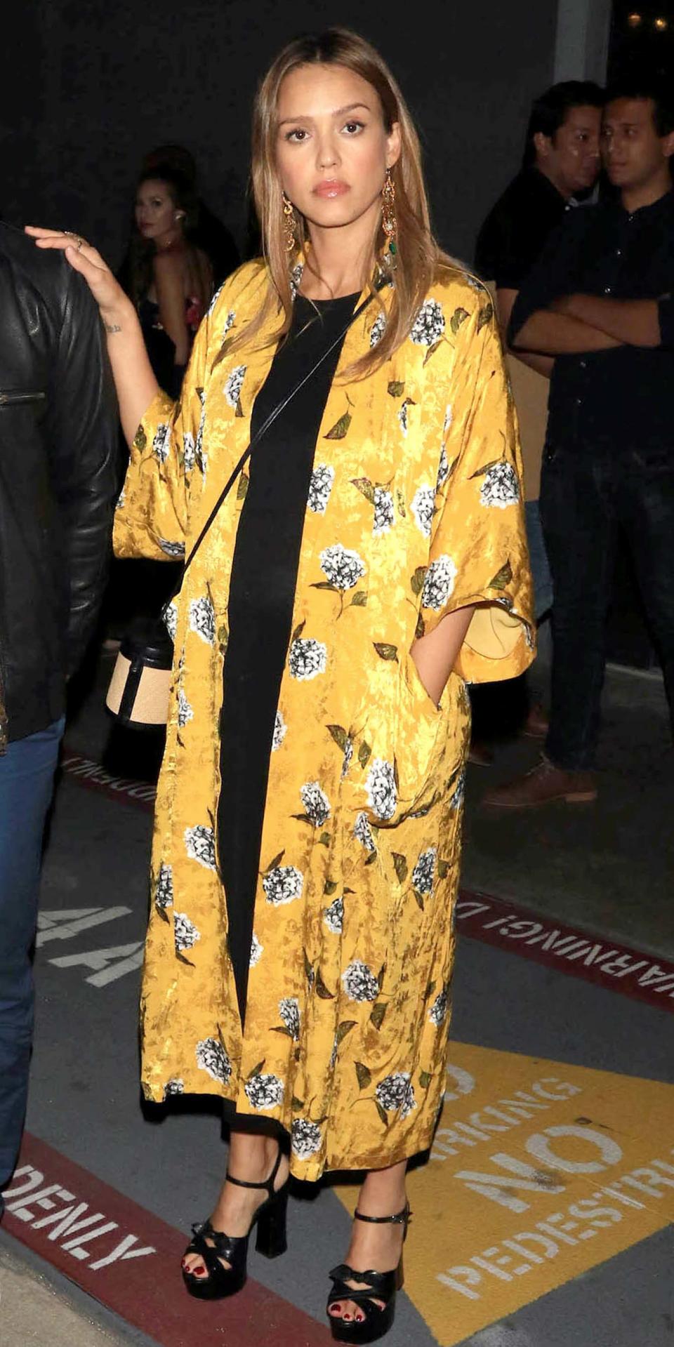 <p>Alba and husband Cash Warren stepped out in Los Angeles on Wednesday evening for a wildly chic weekday date night. The Honest co-founder stunned in a floral yellow kimono from <a rel="nofollow noopener" href="http://us.topshop.com/en/tsus/product/clothing-70483/jackets-coats-2390895/floral-print-maxi-kimono-jacket-6826402" target="_blank" data-ylk="slk:Topshop;elm:context_link;itc:0;sec:content-canvas" class="link ">Topshop</a>, a black maxidress, and a pair of strappy platform Saint Laurent sandals ($905; <a rel="nofollow noopener" href="https://www.farfetch.com/shopping/women/saint-laurent--candy-sandals-item-11596761.aspx" target="_blank" data-ylk="slk:farfetch.com;elm:context_link;itc:0;sec:content-canvas" class="link ">farfetch.com</a>).</p>