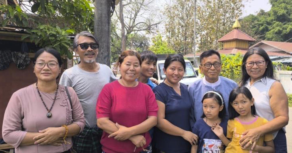 Hkalam Samson, second from right, poses for photography together with his family members, relatives and friends after his release from the prison in Myintkyina township in Kachin state, Myanmar on Wednesday, April 17, 2024. Hkalam Samson, prominent Christian church leader and human rights advocate from Myanmar’s Kachin ethnic minority, was detained by the authorities just hours after he was released from prison under an amnesty by the military government, a relative, a colleague and local media said Thursday, April 18, 2024. (AP Photo)