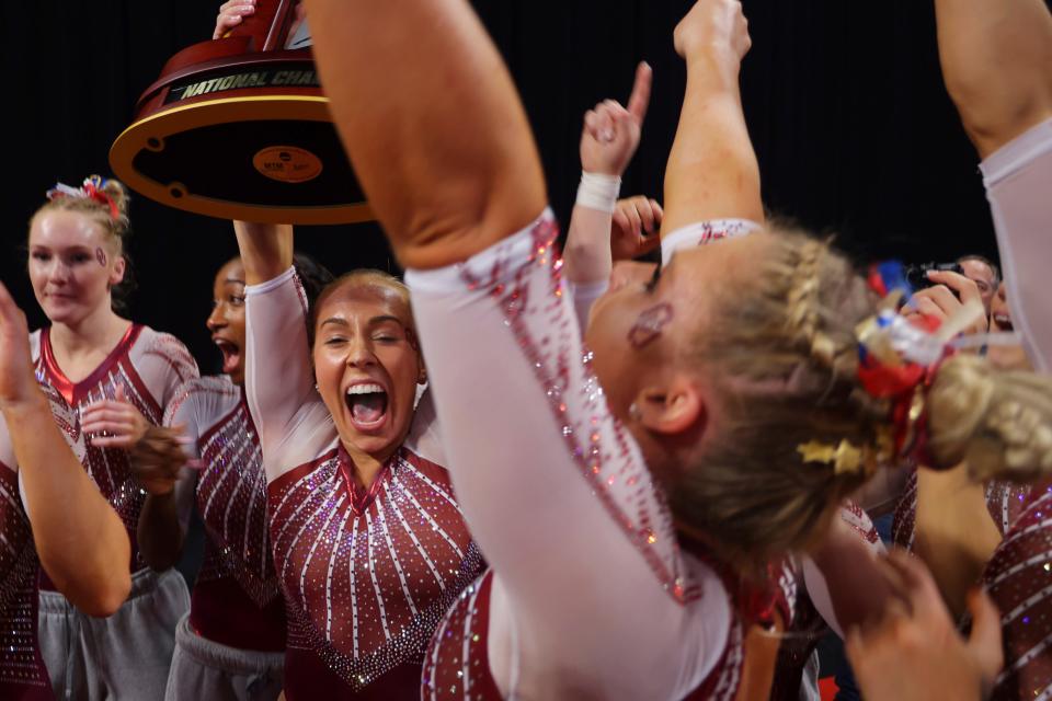 Oklahoma team celebrates their victory together after the NCAA college women's gymnastics championships, Saturday, April 16, 2022, in Fort Worth, Texas.