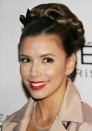 <p>Eva Longoria looks like a housewife from the 50s in a sweet braid up-do.</p>