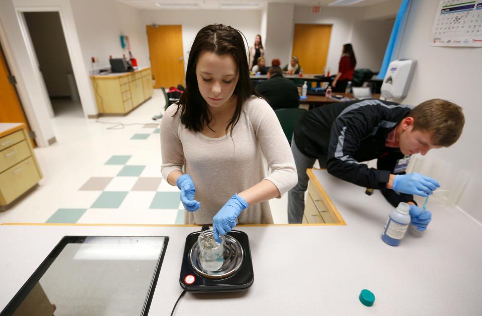 In 2016, students conduct science experiments while working on a lab in their classroom at the CoxNorth hospital. They were part of the Greater Ozarks Centers for Advanced Professional Studies program.