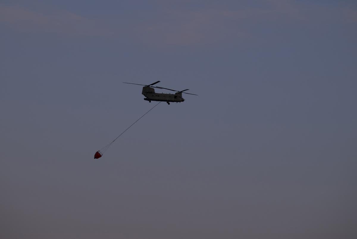 A Chinook helicopter responds to the Roughneck fire near Sanford on March. 3, 2024.