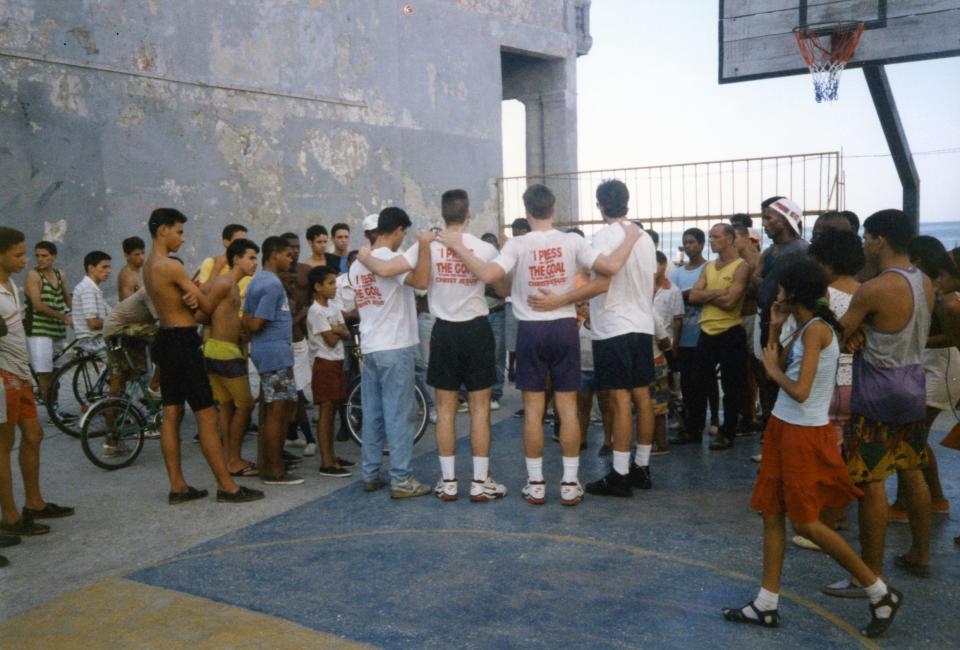 Crossfire Ministries speaks on a basketball court in Cuba.