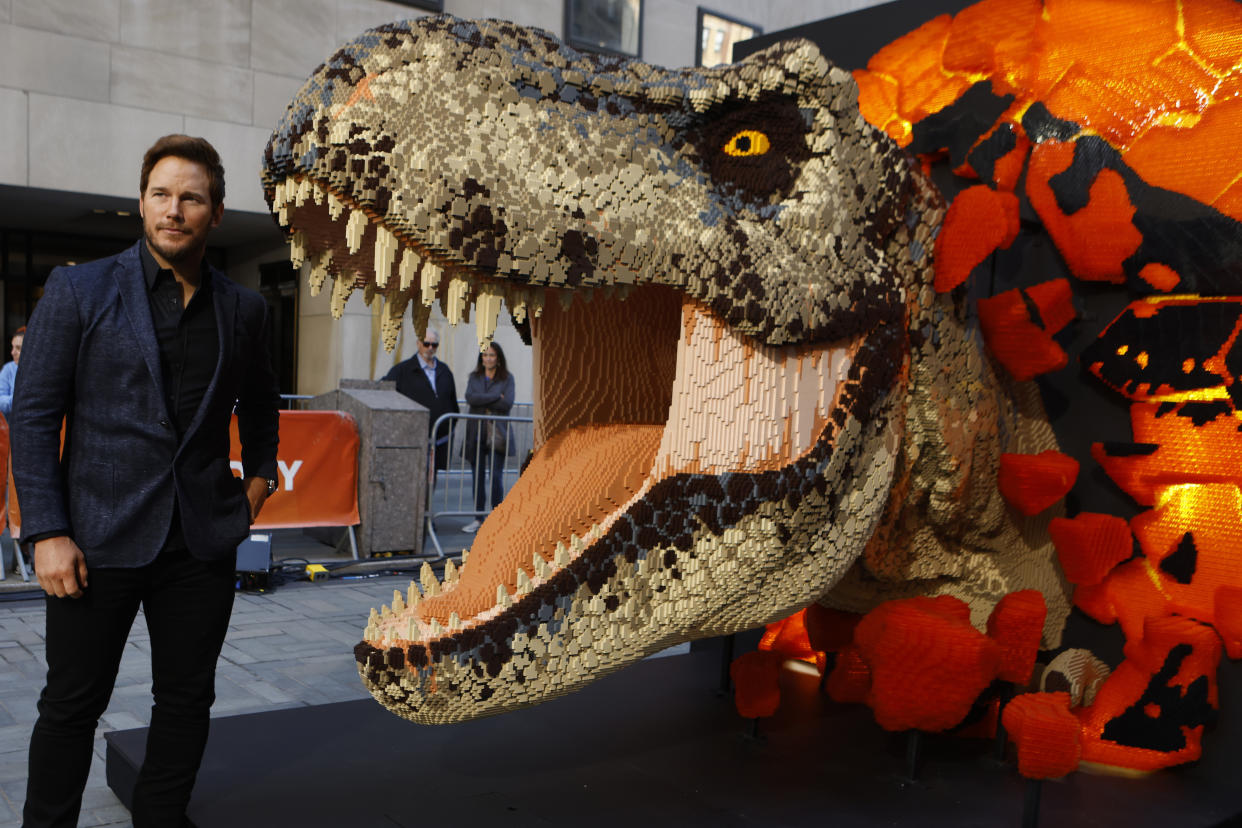 Chris Pratt unveils a life-sized LEGO Jurassic World Dominion T. rex sculpture on the Today show. (Photo by Jason DeCrow/Invision for NBCUniversal and LEGO/AP Images)