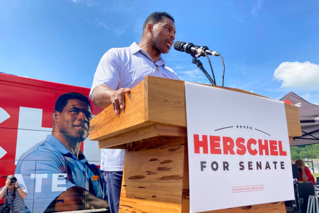 Republican Senate candidate Herschel Walker campaigns Sept. 7, 2021, in Emerson, Ga. Georgia voters will see at least one fall debate between Sen. Raphael Warnock and Republican challenger Herschel Walker. (AP Photos/Bill Barrow, File)