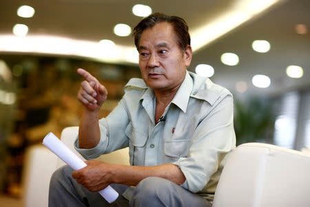 Wang Shiji, founder of the Defend Mao Zedong People's Party, speaks during an interview in Beijing, China, August 21, 2016. Picture taken August 21, 2016. REUTERS/Thomas Peter