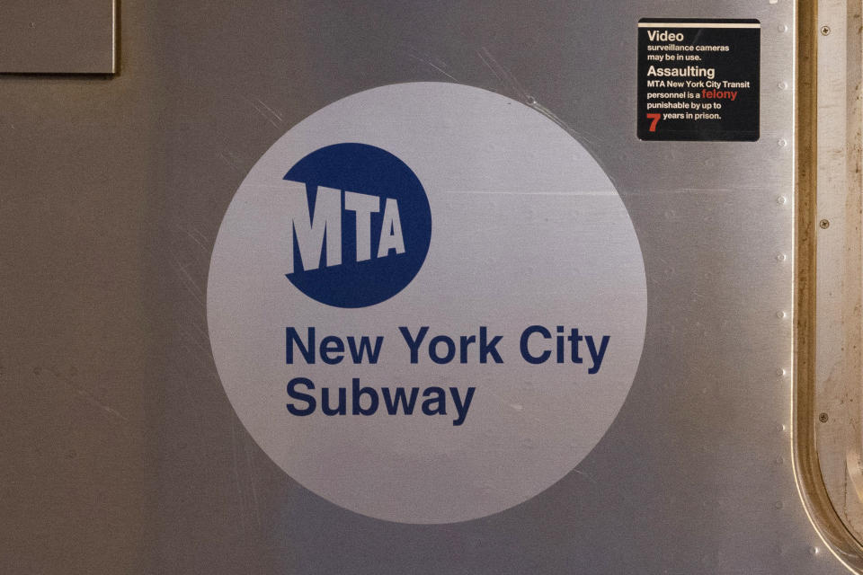 FILE - The MTA logo is seen on the side of a New York City subway car, April 23, 2020, in the Queens borough of New York. A subway rider was pushed onto the tracks and killed by a train. The attack was the latest in a string of violent episodes in New York City’s transit system that have prompted officials to beef up policing in the subway system. The shoving victim was pushed onto the tracks inside an East Harlem subway station shortly before 7 p.m. Monday, March 25, 2024. (AP Photo/Mark Lennihan, File)