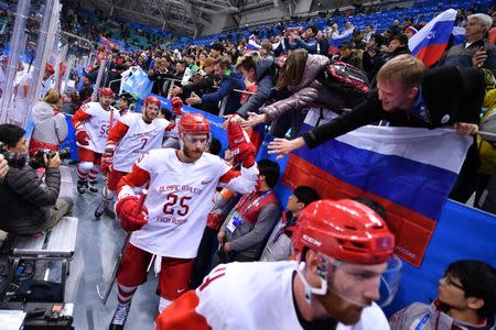 Feb 23, 2018; Gangneung, South Korea; Russia forward Mikhail Grigorenko (25) greets fans after defeating the Czech Republic the men's ice hockey semifinals during the Pyeongchang 2018 Olympic Winter Games at Gangneung Hockey Centre. Mandatory Credit: Andrew Nelles-USA TODAY Sports